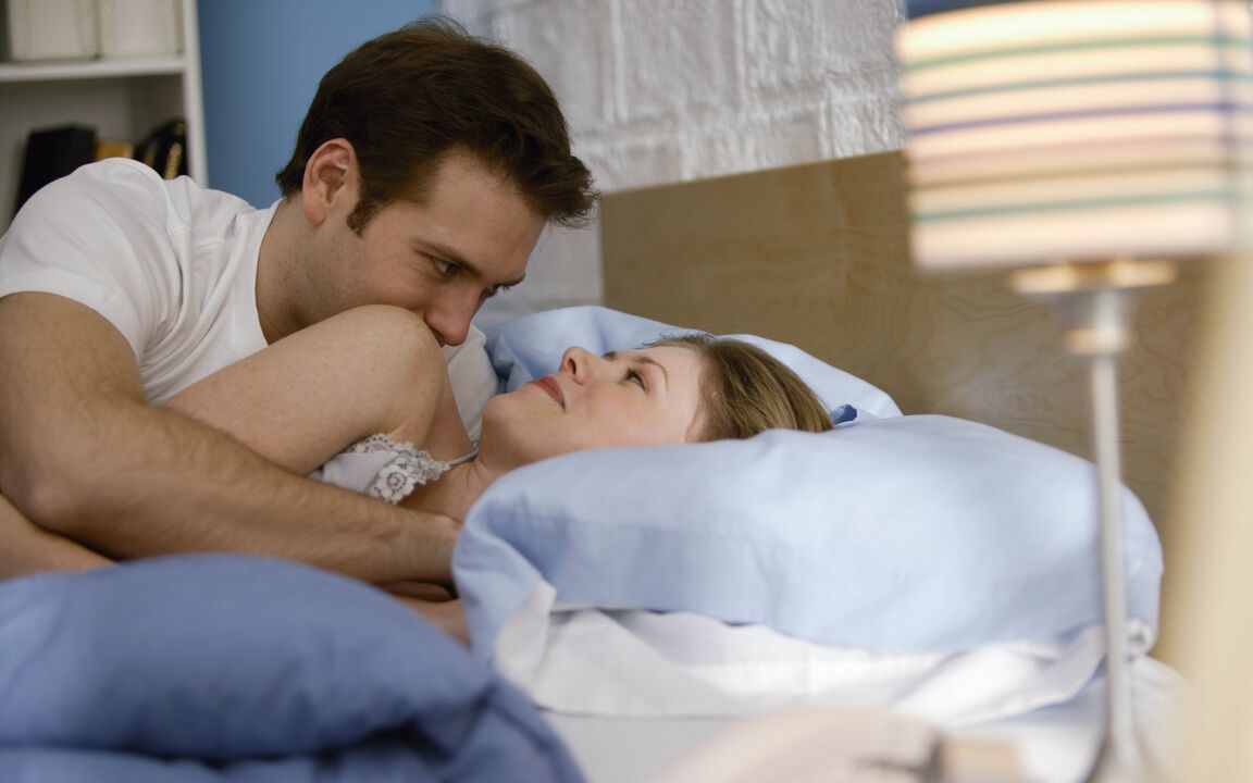 woman in bed with a man with a penis enlargement